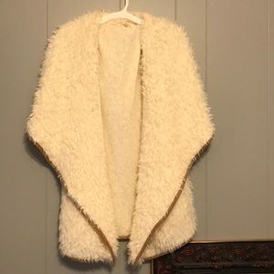 White fur vest